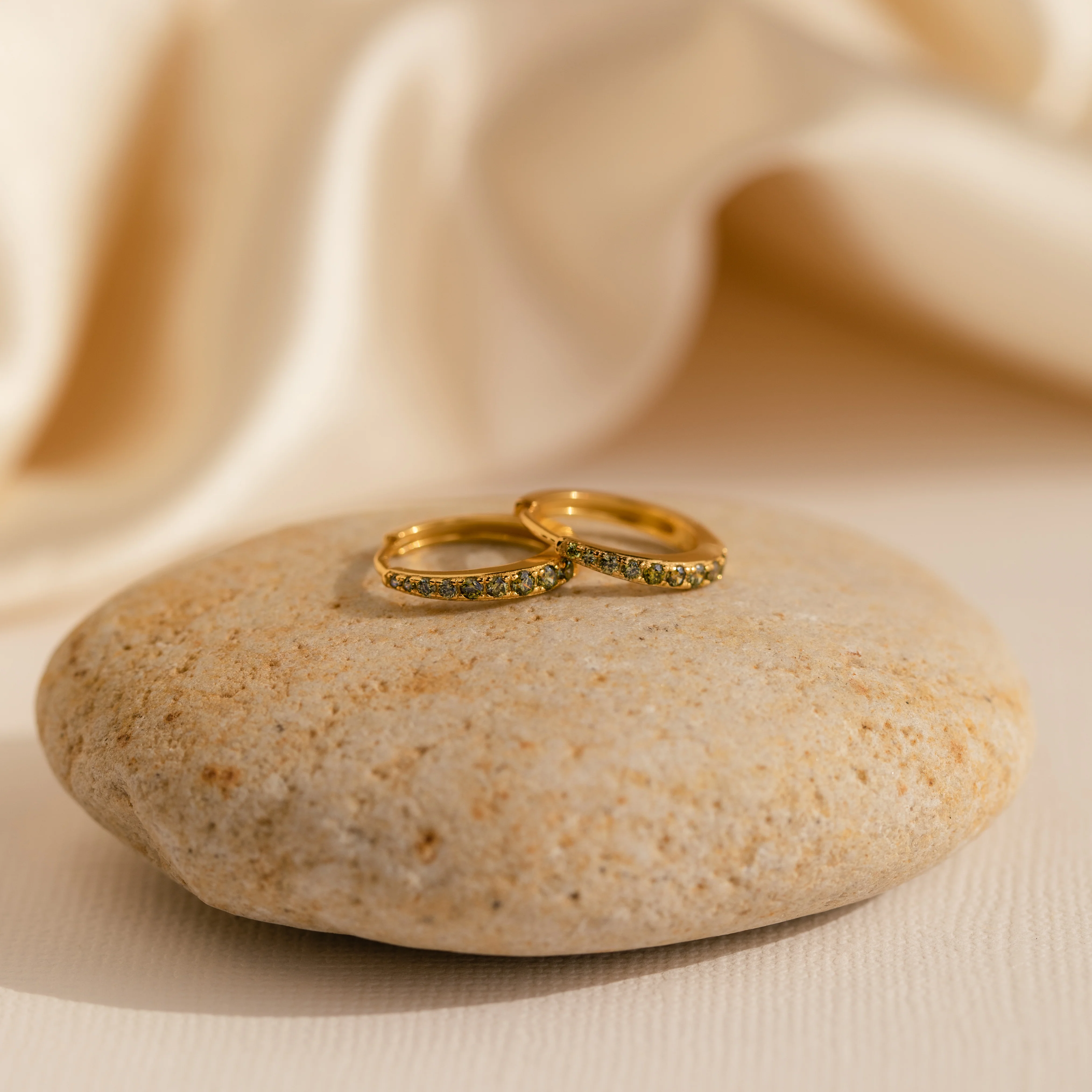 Vera Pave Peridot Huggies